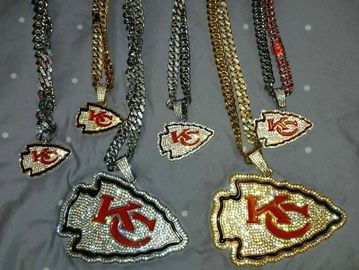 Chains with Kansas City Chiefs logo pendants in silver and gold tones.
