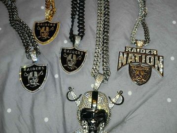 Collection of Raiders-themed necklaces with various pendants and chains.