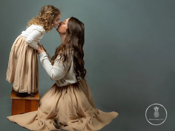 Fine Art Portrait Photographer with Editorial Flair in CHarleston SC Mother and child kissing 