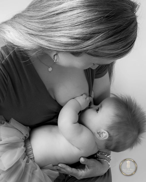 Fine Art Newborn Portrait editorial vibe Charleston SC Black/White mother breast feeding baby 