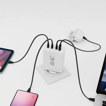 A multi-port USB charger powering multiple devices simultaneously on a white surface.