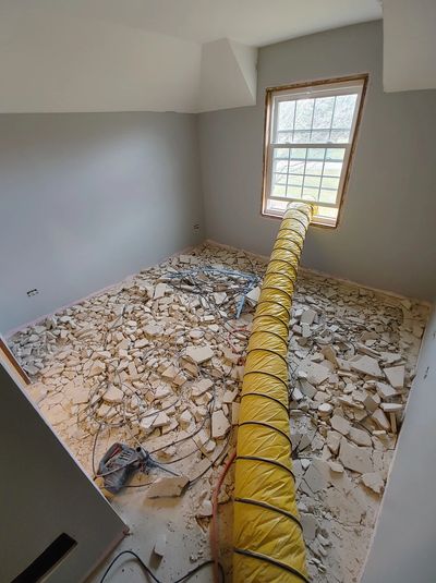 vent pipe in a room that has demolished flooring