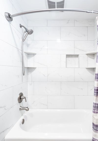 Ceramic tile installation with showing plumbing fixtures install