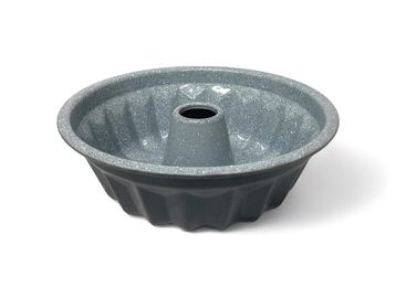 Gray bundt cake pan with glittery interior.