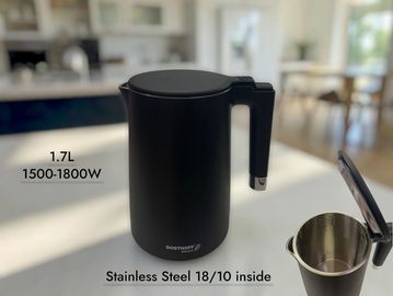 Black electric kettle with stainless steel interior.