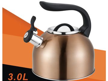 Shiny copper whistling kettle with black handle and lid knob.
