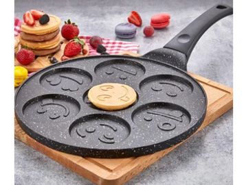 Non-stick pancake pan with smiley face molds.