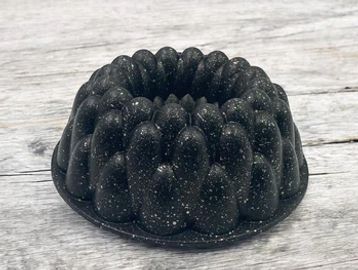 Black speckled silicone bundt cake mold.