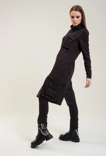 Woman in a black futuristic outfit with boots.