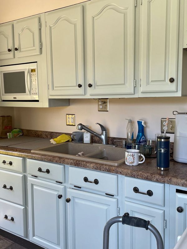 From bare wood to a modern dream. Light color changes helped us to open up her kitchen space. 