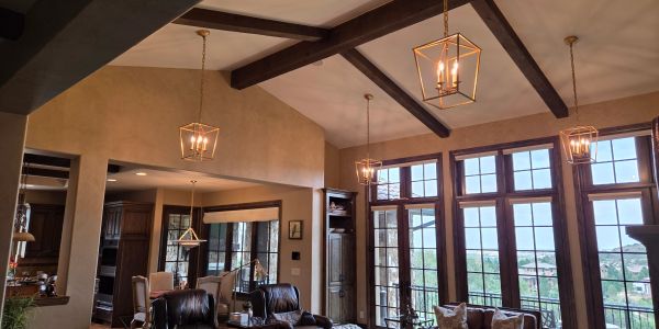 Spacious living room with large windows and elegant lighting.
