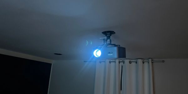 Bright ceiling-mounted projector in a room.
