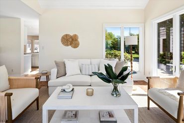 Hamptons home staging -- sunroom in elegant, neutral tones.