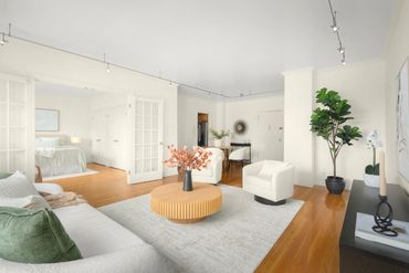 Image of NYC home staging living/dining room, with autumnal colors.