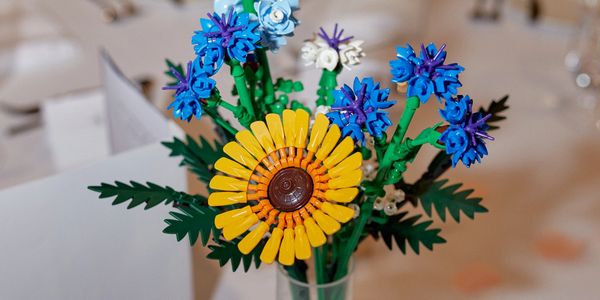 Colorful LEGO flowers arranged in a vase.