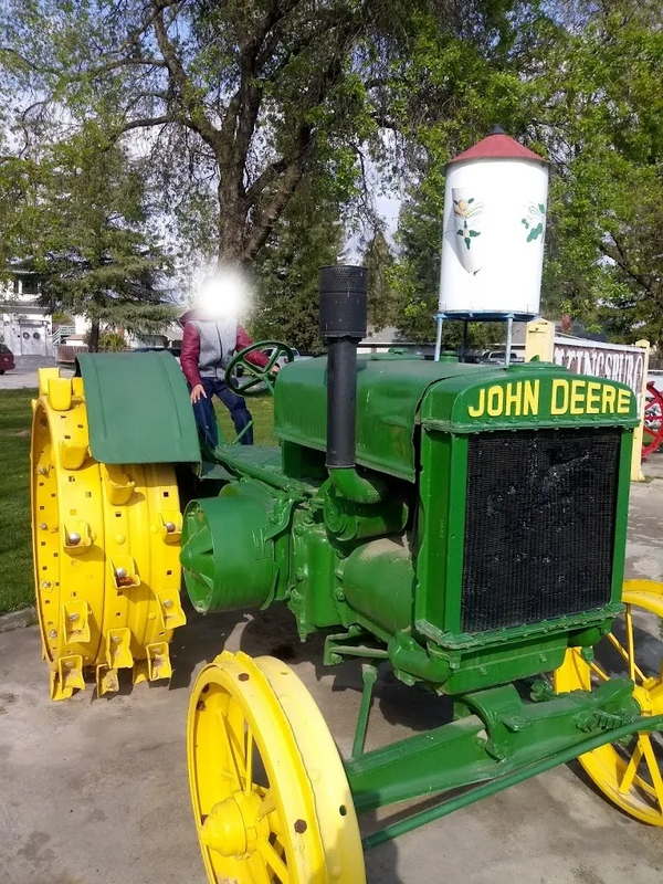Boy on John Deere tractor at Kingsburg Historical Park