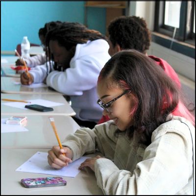 Teen writing in our Creative Expression class