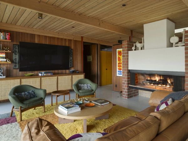Cozy living room with fireplace and modern decor.