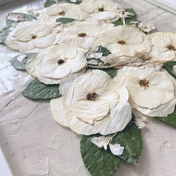 White roses are individually taken apart and preserved to created a beautiful keepsake