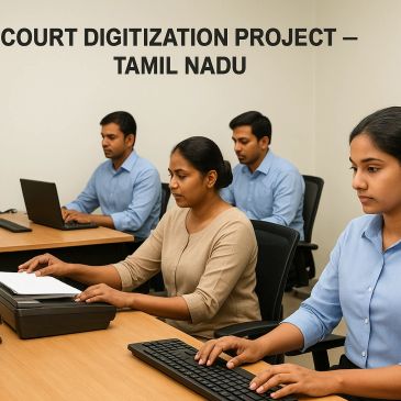 Four professionals working on computers for Tamil Nadu's Court Digitization Project.
