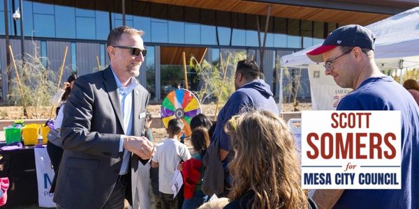 Scott Somers shaking hands at a community event promoting his Mesa City Council campaign.