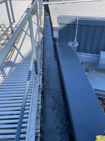 Commercial roof and gutter cleaning