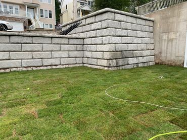 Precast concrete retaining wall and new lawn