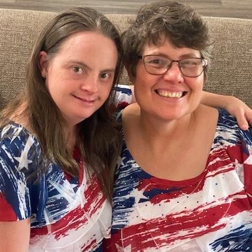 Two residents from Heart of Georgia DDM wearing American flag t-shirts
