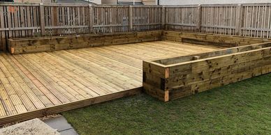 Decking with raised planter beds.