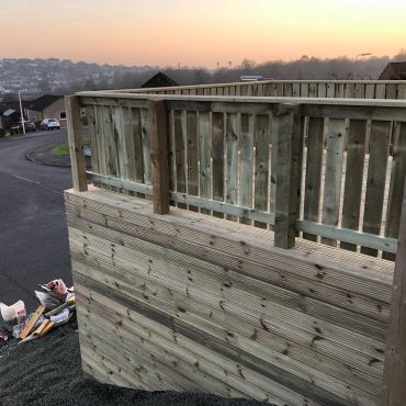 Raised deck on a hill.