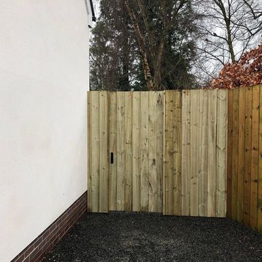 Closed board gate and fence section for privacy.