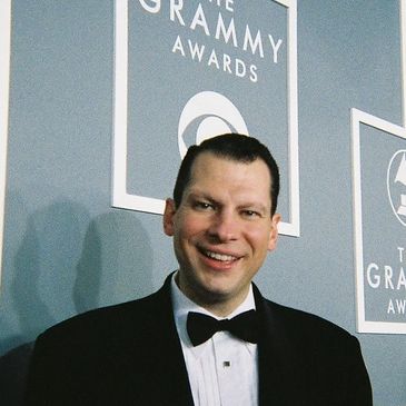peter oprisko (white male) in a tux at the grammy awards
