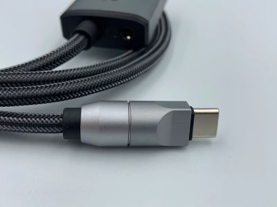 Close-up of a USB-C cable with braided exterior.
