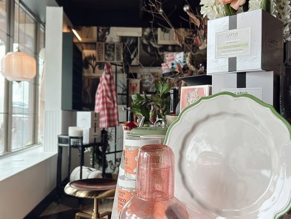 Cozy indoor scene with elegant tableware and decorative items on display.