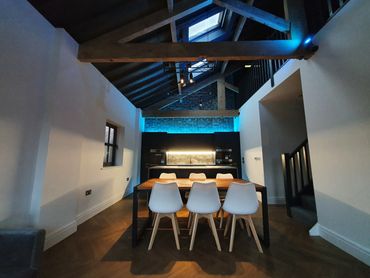 Exposed timber beams in converted Victorian warehouse in Southport