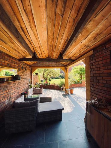 Natural timber cladding to converted garage and slate paving in Birkdale Southport