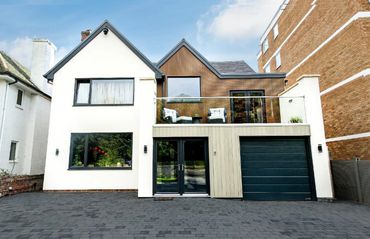 Remodelled and refurbished house front with composite cladding and new driveway in Southport