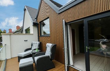 Remodelled and refurbished house front with composite cladding and new driveway in Southport