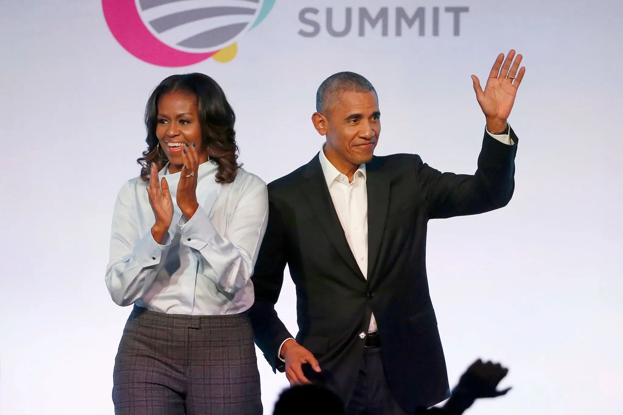 Michelle and Barack Obama -- Charles Rex Arbogast/Associated Press