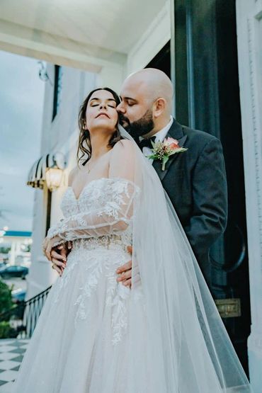 Bride and groom hold each other on the day of their wedding 