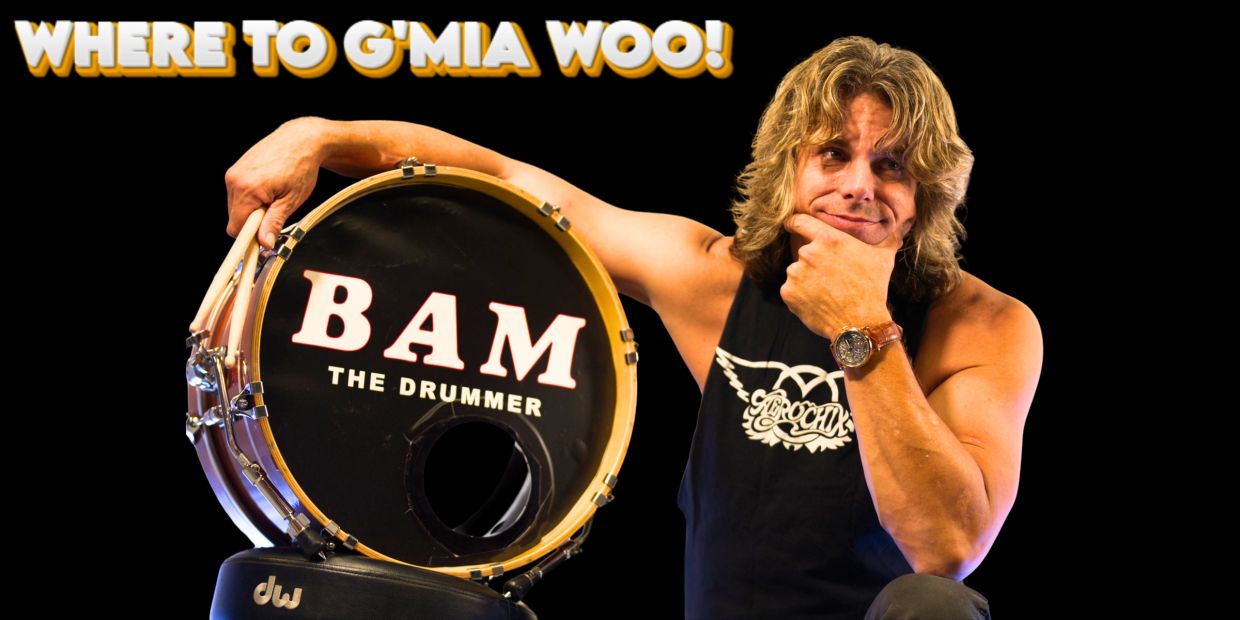 Drummer Bam poses with his drum under the text 'Where to G'Mia Woo!'