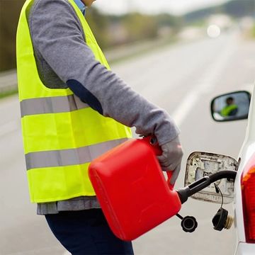 Emergency fuel delivery to stranded driver by Daniels 24/7 Roadside Bloomington IN.
