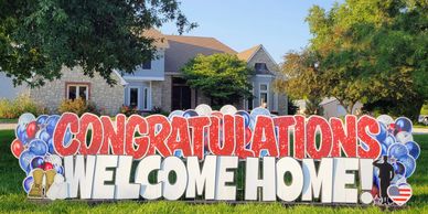 CONGRATULATOINS WELCOM HOME IN RED AND WHITE IN RAYMORE, MO.  FROM YARD PROPS