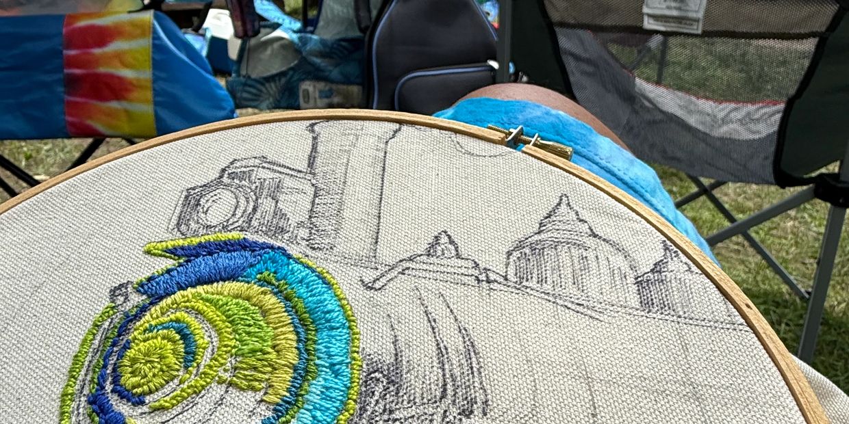 Laura is working on the Bluegrass Express patch at Mama Strings celebration of life