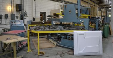 Rotary vacuum former for high-speed, medium volume jobs using medium to heavy gauge plastics.
