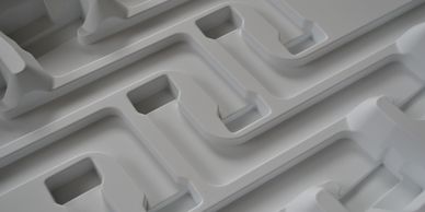 Sample of thermoformed custom packaging material.
