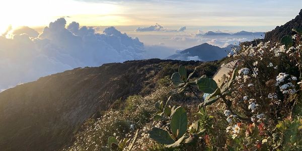 mountain top sunshine clouds