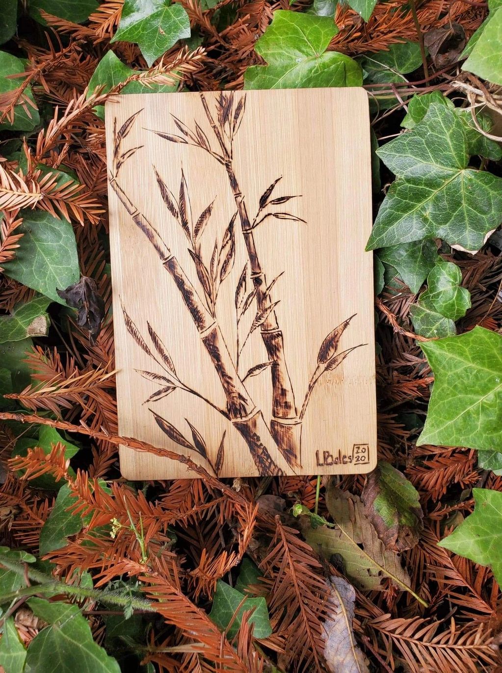 Bamboo wood burn on bamboo cutting board still life of bamboo