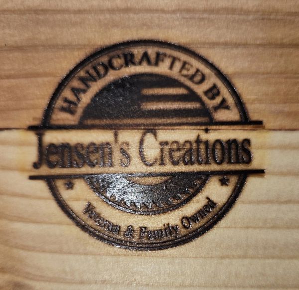 Wood brand stamp for Jensen's Creations.