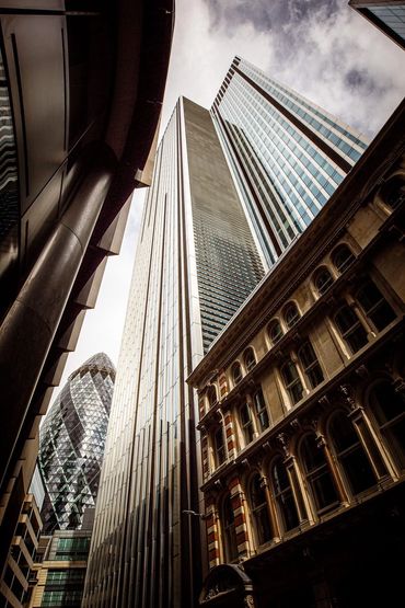 View of tall skyscrapers in a city from street level.